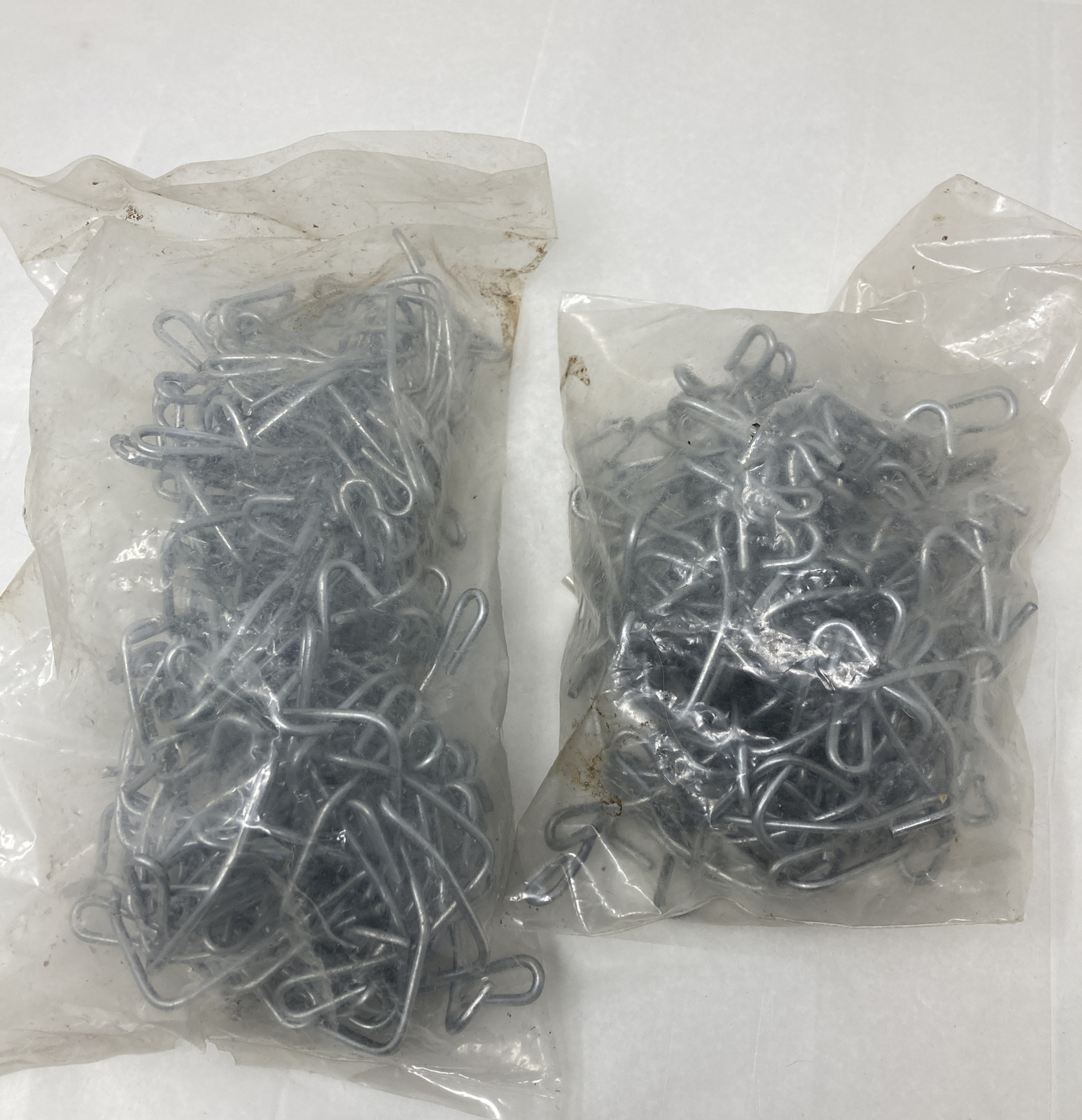 2 Unopened Bags T-Post Clips 3.7 Lbs Total Weight. No In Bags Unknown